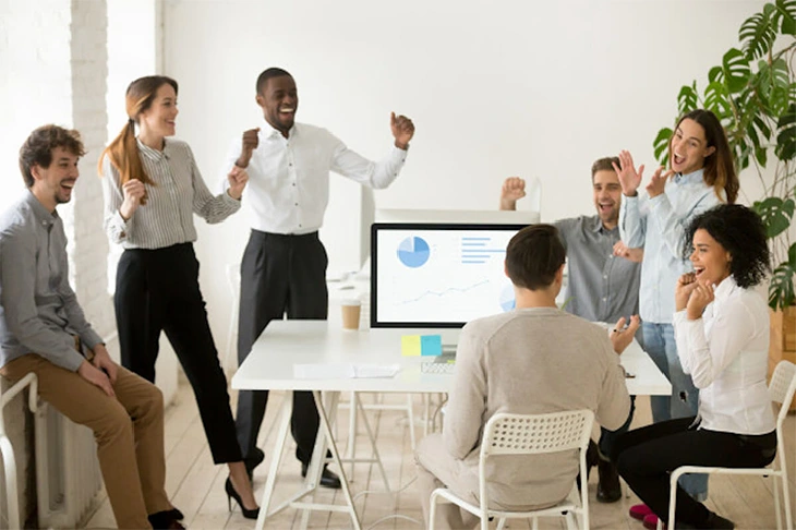 group of employees cheering up