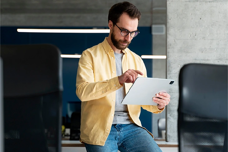 man checking out tablet